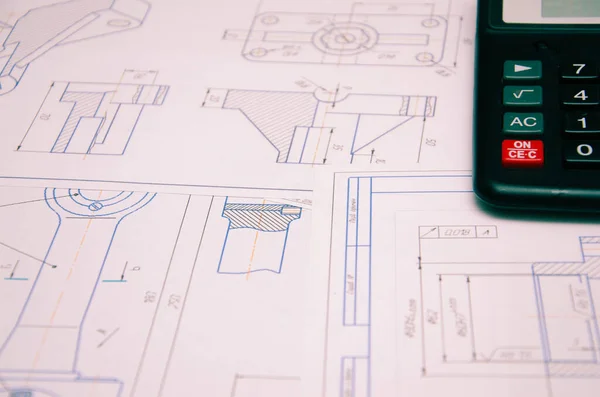 High angle view on the plan of electrical installation with calculator darck