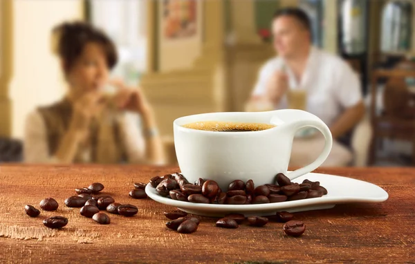 Cup of coffee on table in cafe — Stock Photo, Image