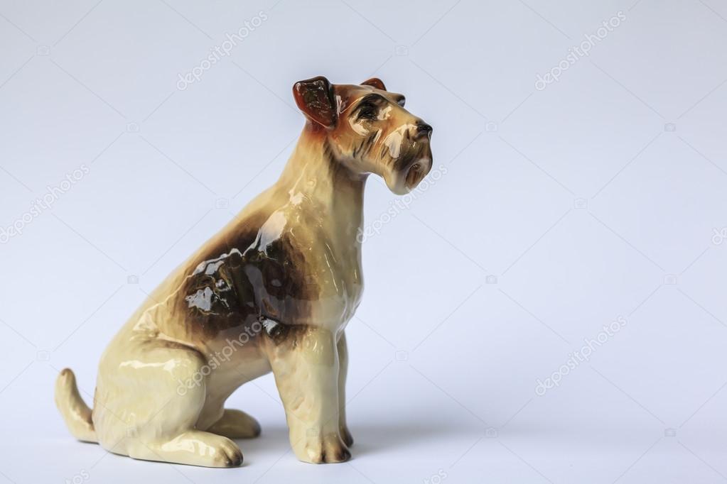 Decorative porcelain dog isolated on a white background