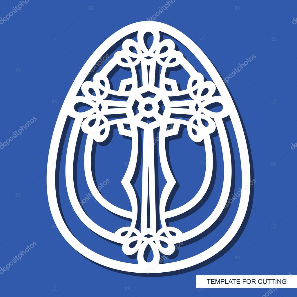 Decorative Easter egg with an ornate cross. Religious element. Oval shape. Template for plotter laser cutting, wood carving, paper cutting, metal engraving or printing.  Vector illustration.