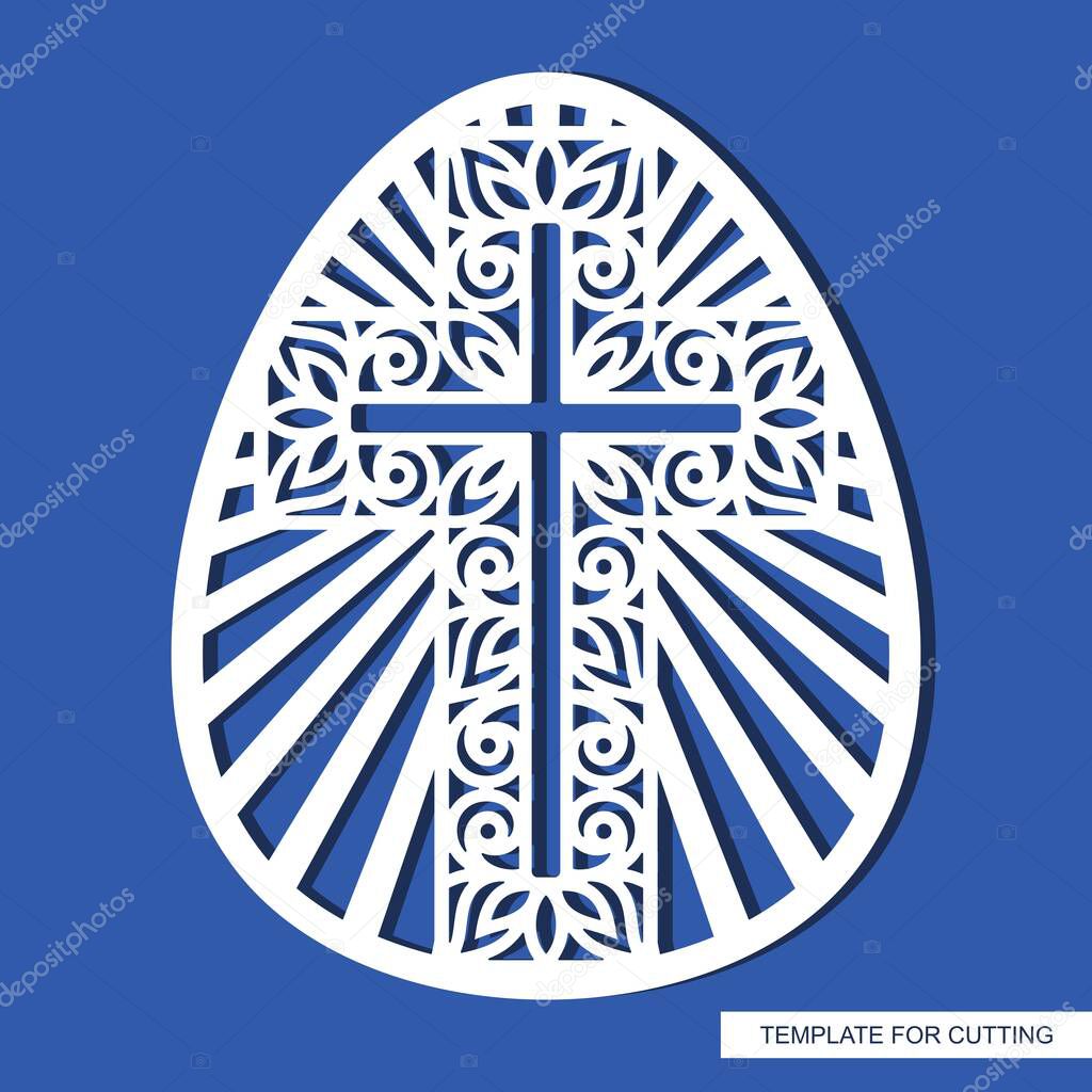 Decorative Easter egg with an ornate cross. Religious element. Oval shape. Template for plotter laser cutting, wood carving, paper cutting, metal engraving or printing.  Vector illustration.