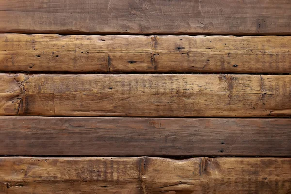 Vintage background from wooden oak planks. Aged boards on the wall. Roughly finished textured wood planks for interior, floor, wall decoration