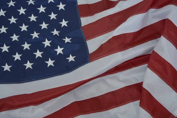 USA flag, close-up. Studio shot. USA flag background. Stars displaying on waving American flag in filled frame layout.