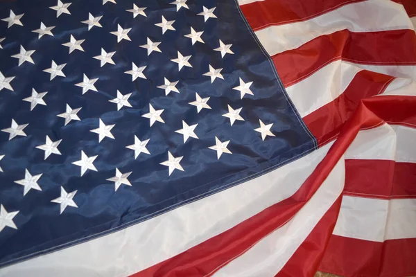 USA flag, close-up. Studio shot. USA flag background. Stars displaying on waving American flag in filled frame layout.