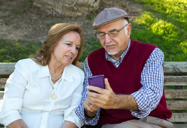 Senior man and senior woman doing a self-portrait — Stock Photo, Image