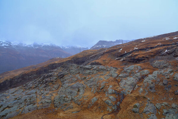 View of alp mountain in autumn have snow on top hill 