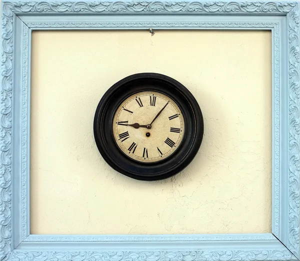 Antique wall clock in a picture frame — Stock Photo, Image