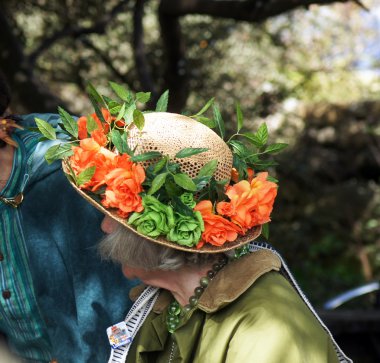 Lady with flower decorated hat