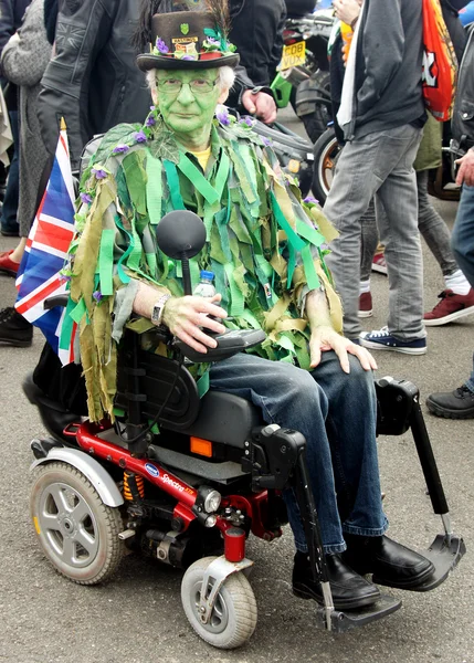 Green faced men on wheelchair — Zdjęcie stockowe