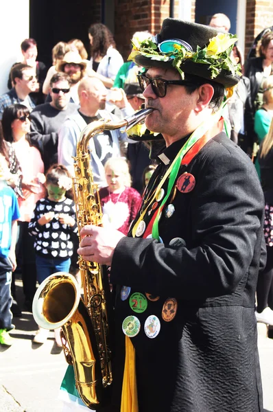 Man plays saxophone in a parade — Stock Photo, Image