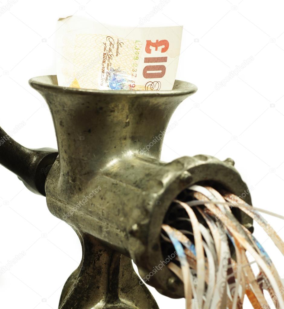 Pound note in a meat grinder