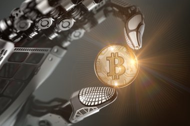 Mekanik kolda parmaklarıyla bitcoin tutan robot