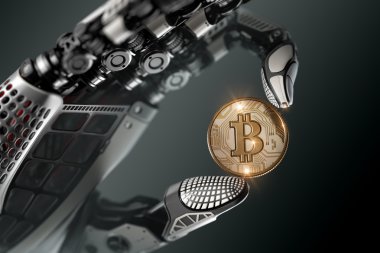Mekanik kolda parmaklarıyla bitcoin tutan robot