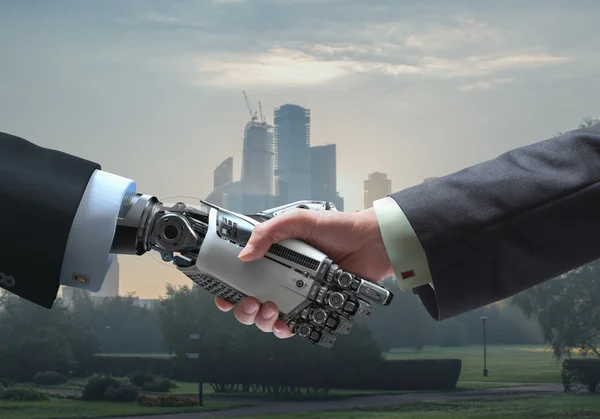 Digitalt kommunikasjonssymbol Menneskelige hender og roboter i håndtrykk – stockfoto