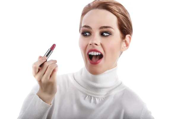 A red head girl holding lipstick in hand — Stock Photo, Image