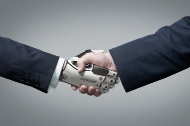 İş insan ve Robot el içinde el sıkışma