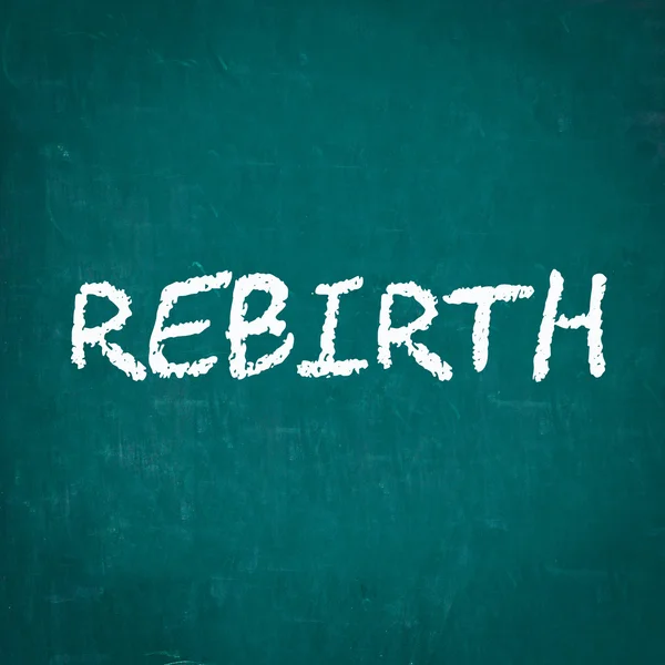 REBIRTH написано на доске — стоковое фото