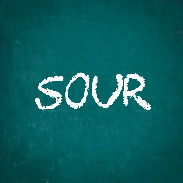 SOUR escrito en pizarra —  Fotos de Stock