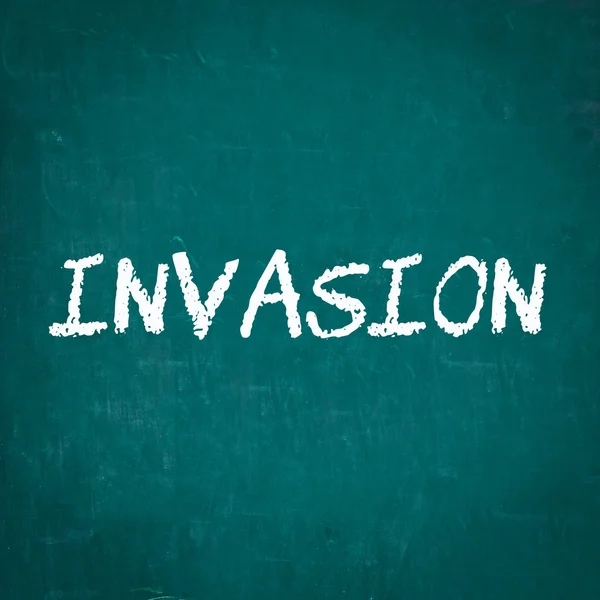 INVASION written on chalkboard — Stock Photo, Image