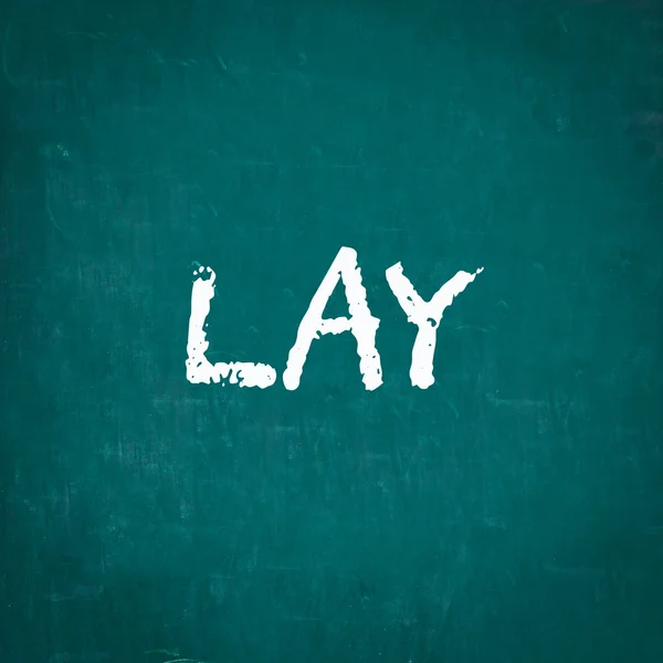 LAY escrito en pizarra —  Fotos de Stock