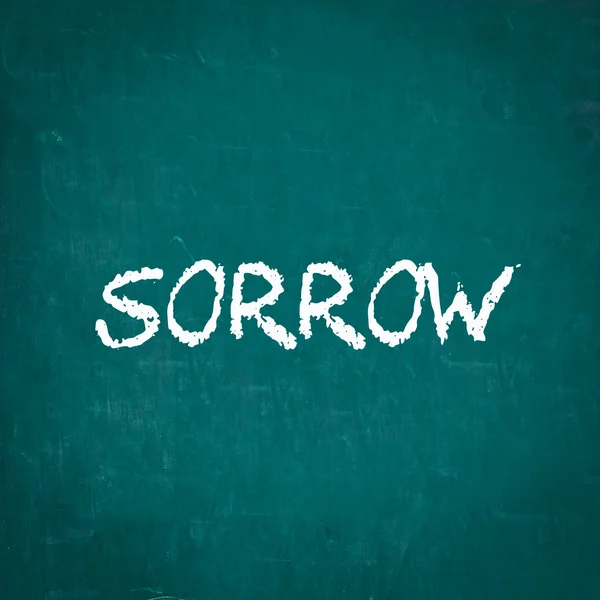 SORROW written on chalkboard — Stock Photo, Image