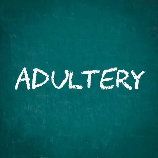 ADULTERY written on chalkboard — Stock Photo, Image