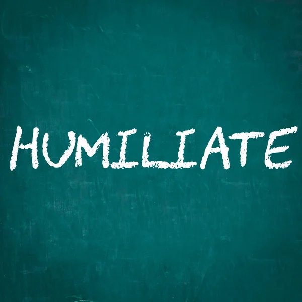 HUMILIATE written on chalkboard — Stock Photo, Image