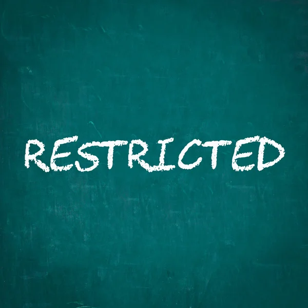 RESTRICTED écrit sur un tableau — Photo