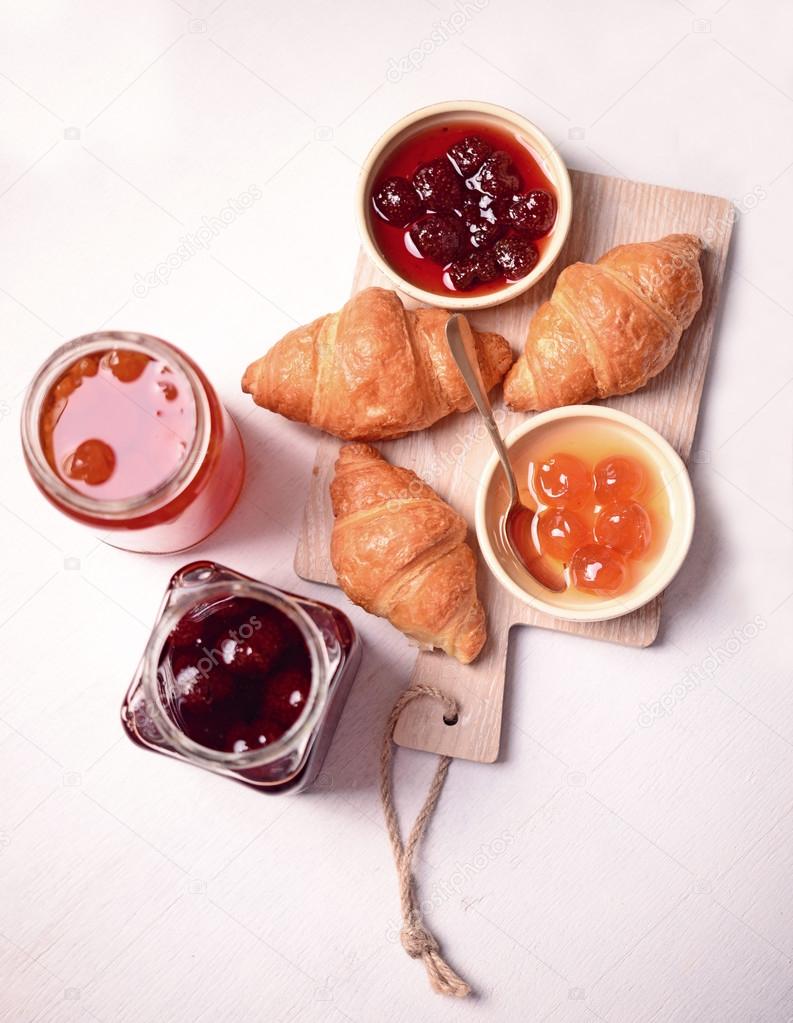 Breakfast with fresh croissants and jam