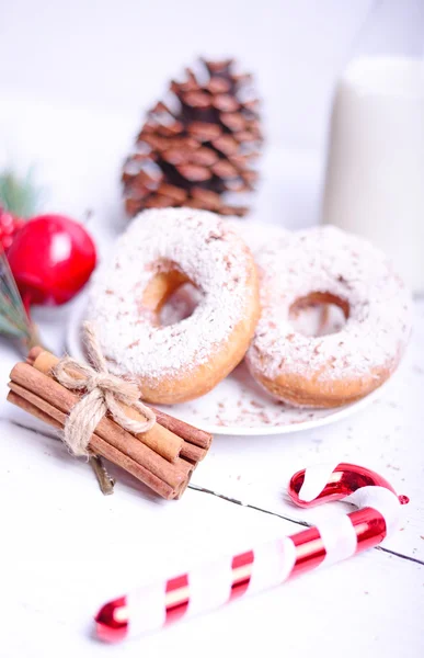 Christmas donuts on white wooden table — Stock Photo, Image