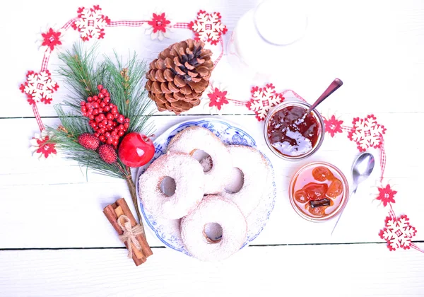 Christmas donuts on white wooden table — Stock Photo, Image