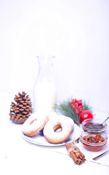 Donuts for Christmas breakfast on white wooden table — Stock Photo, Image