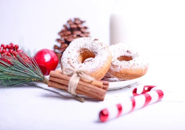 Fresh Christmas donuts on white wooden table — Stock Photo, Image