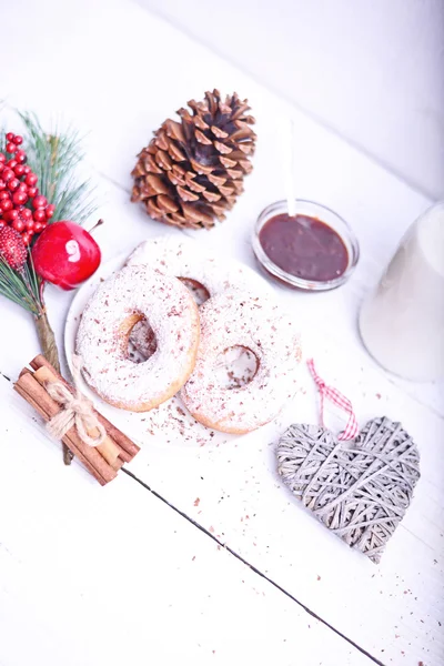 Fresh donuts on white wooden table — Stock Photo, Image