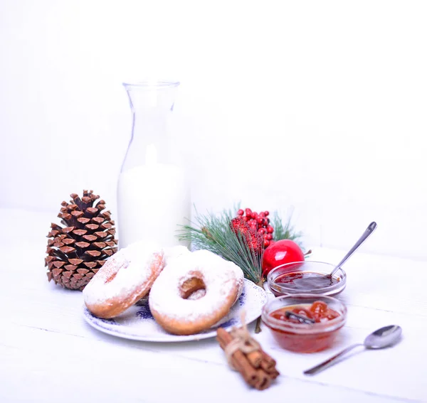 Fresh donuts on white wooden table — Stock Photo, Image
