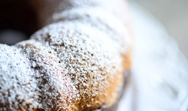 Macro of powder sugar on cocoa gugelhupf — Stock Photo, Image