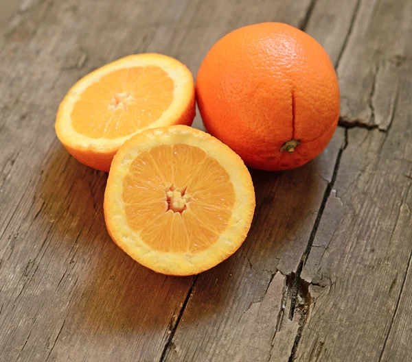 Fresh orange on wooden backgroud — Stock Photo, Image