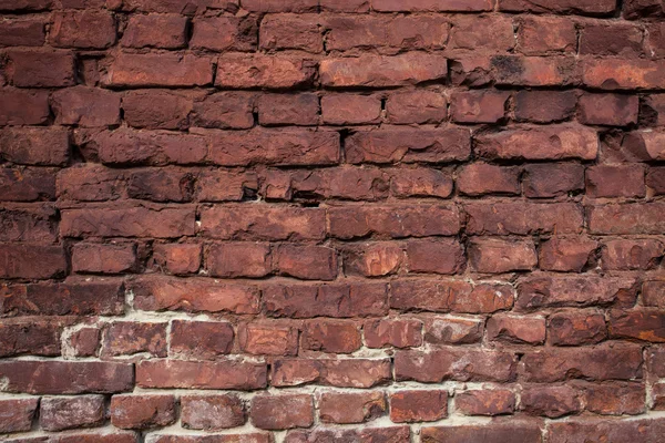 Oude beschadigde rode bakstenen muur achtergrond — Stockfoto