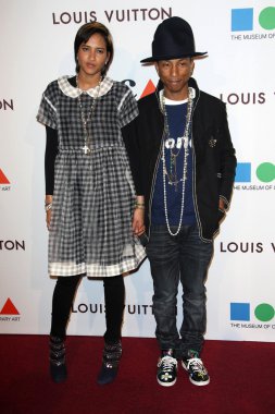 Pharrell Williams and Helen Lasichanh