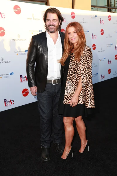 Shawn Sanford, Poppy Montgomery — Photo