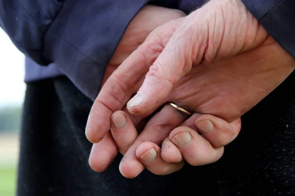 Old man\'s hands with fingers together, close-up. Unrecognizable caucasian very old man\'s hands