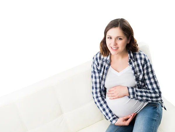 Schöne junge schwangere Frau lässig gekleidet — Stockfoto