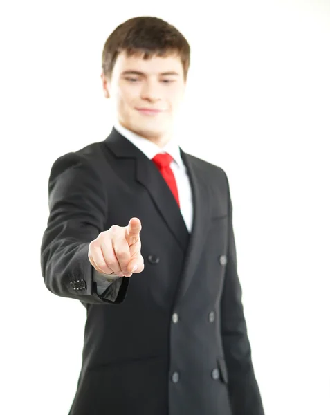 Young successful businessman pressing imaginary button isolated on white — Stock Photo, Image