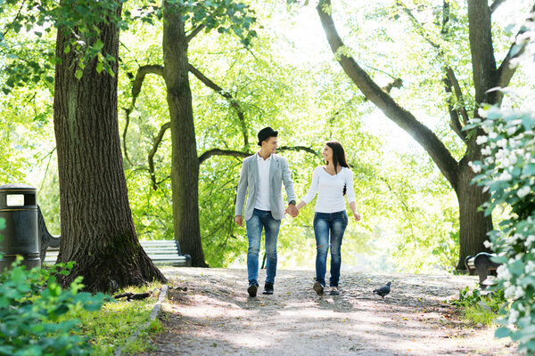 Young beautiful couple being on a date and having sensual walk