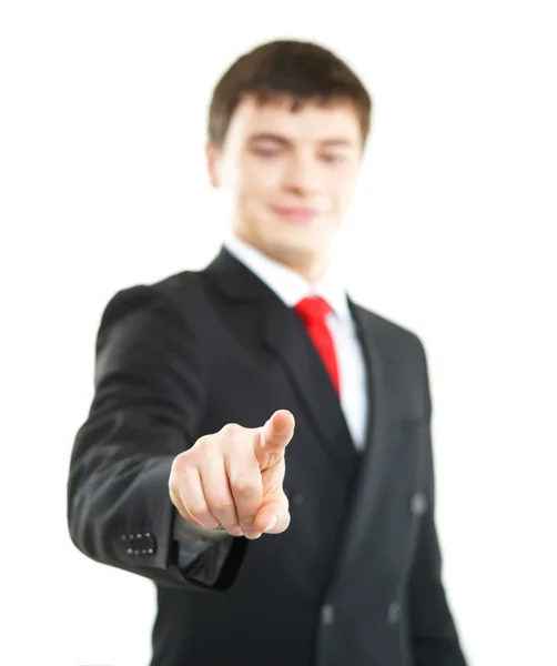 Young successful business man pressing imaginary button isolated on white — Stock Photo, Image