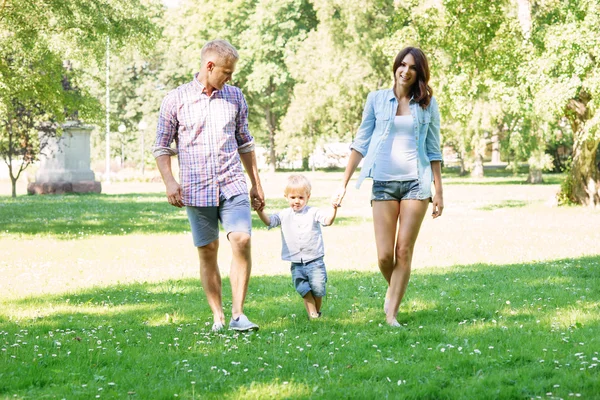 Parents having a walk with their son — Stock Photo, Image