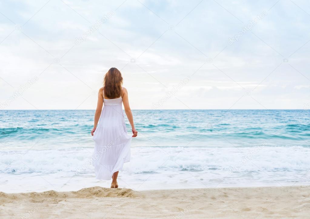 Woman in a white dress on the beach — Stock Photo © shmeljov