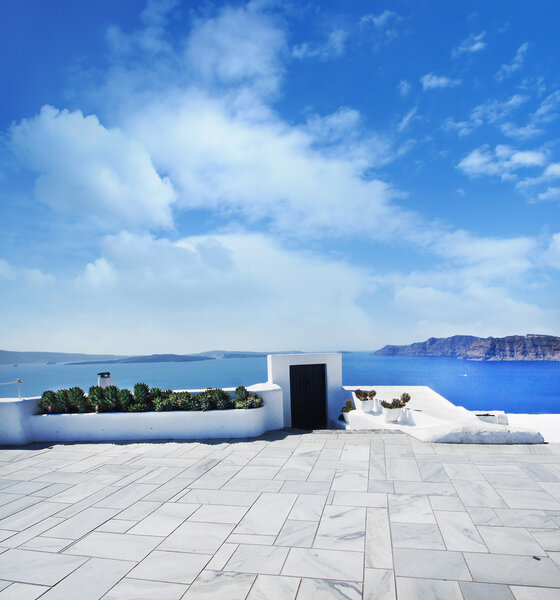 Terrace on Santorin island with a view on azure Mediterranean se