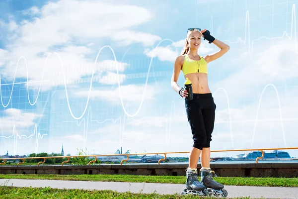 Young and fit woman rollerblading on skates — Stock Photo, Image