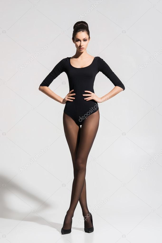 Beautiful, seductive woman posing in hosiery and heels Stock Photo